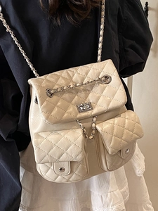 Quilted beige backpack with chain straps and dual front pockets in elegant style