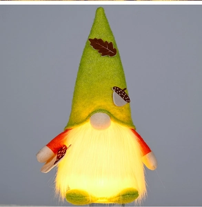 Detail of glowing beard with LED lights on a plush autumn gnome with acorn hat