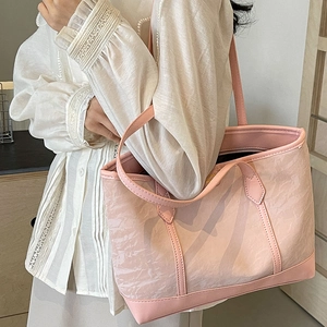Pink large capacity tote bag for women with leather handles and textured fabric finish
