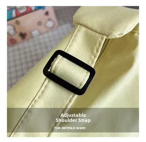 Detail of adjustable shoulder strap on minimalist pale yellow canvas tote bag