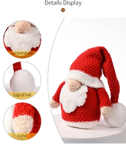 Detail view of knitted Christmas gnome ornaments showing texture, hat top and hand craftsmanship