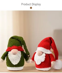 Close-up of handmade knitted Christmas gnomes with textures on a wooden table