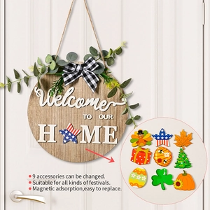 Detail of wooden welcome sign with 9 magnetic interchangeable holiday icons and a bow