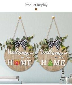 Wooden round welcome home door sign with interchangeable holiday icons and greenery