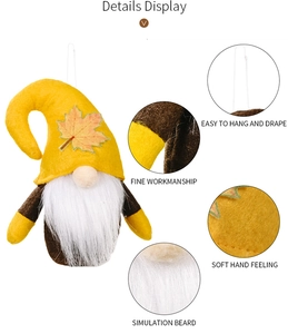 Detail of autumn gnome plush with maple leaf hat, long white beard and hanging string