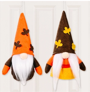 Detail of autumn gnome hanging ornaments with maple leaf hats for Thanksgiving decor