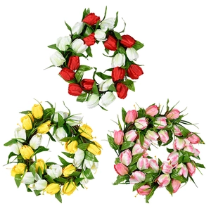 Vibrant artificial tulip flower wreath in red, yellow and pink for spring home decor