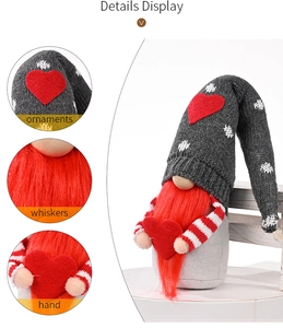 Close-up of heart-holding gnome with grey knitted hat and red faux fur beard details