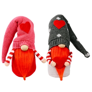 Pair of Valentine knitting Gnomes with red hearts and plush beards on white background