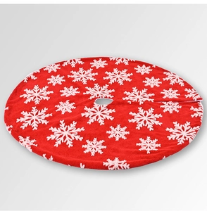 Detailed close-up of red Christmas tree skirt with white snowflake jacquard pattern