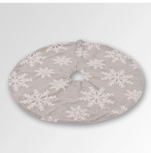 Close-up of grey plush Christmas tree skirt with thick 3D white snowflake embroidery