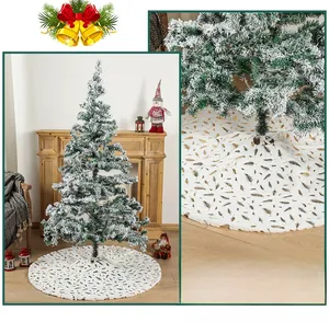 Detail of white plush Christmas tree skirt featuring golden feather foil patterns in a festive room