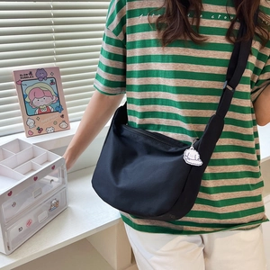 Minimalist black canvas crescent crossbody bag for women with cute cloud charm