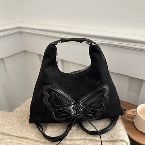 Sac à dos noir vintage avec nœud papillon texturé et poignée supérieure pour femme