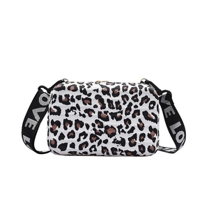 White leopard print crossbody box bag with textured stripes and LOVE woven strap