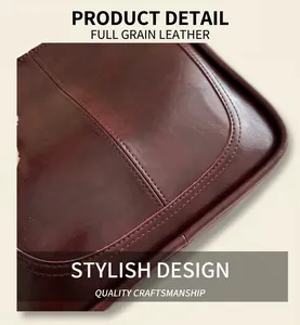 Detailed close-up of double-stitched seams on vintage dark red oil-wax leather tote bag