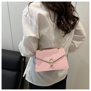 Pink woven texture shoulder bag featuring gold chain strap and U-shaped metal lock