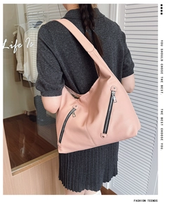 Detailed back view of a light pink lychee texture tote bag with silver zippers for daily wear