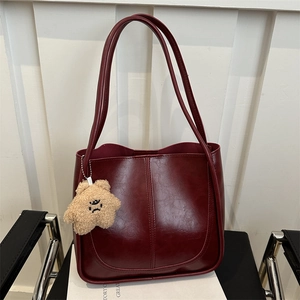 Retro deep wine red faux leather tote bag with plush star charm and spacious design