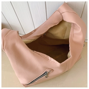 Top view of pink litchi grain leather bag showing spacious interior and metal zipper