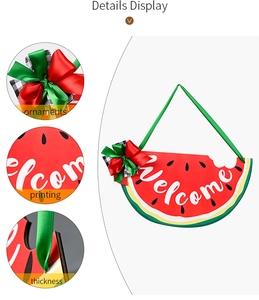 Detail view of wooden watermelon welcome sign showing bow knot and print texture