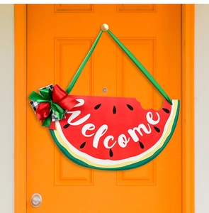 Detail of summer watermelon door sign with bow and white Welcome lettering