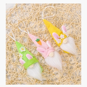 Detailed view of three felt Easter gnomes with rabbit ears and hanging ribbons