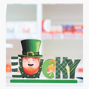Close-up of wooden St. Patrick's Day Lucky sign with gnome and clover on base