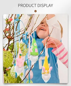 Close-up of colorful faceless Easter gnome ornaments hanging on indoor plant branches