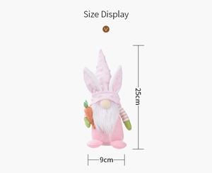 Size display of a pink polka dot Easter gnome with rabbit ears holding a carrot