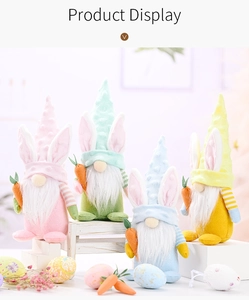 Set of four pastel Easter gnomes with rabbit ears and carrots in soft macaron colors