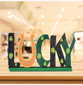 Detail of wooden LUCKY letters with shamrock patterns for St. Patrick's Day decor