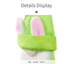 Detailed close-up of Easter gnome with green felt fabric and pink rabbit ears