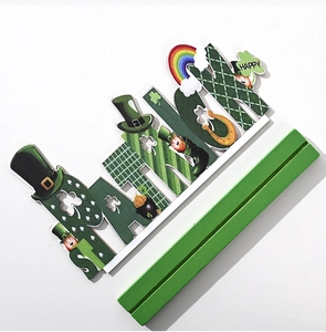 Detail of St. Patrick's Day wooden centerpiece with Leprechaun and shamrock icons