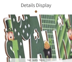 Macro view of St. Patrick's Day wooden letter sign with green clover and leprechaun print