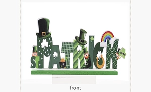 Detail of St. Patrick's Day wooden centerpiece with shamrock and rainbow motifs