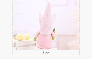 Back view of a pink Easter gnome featuring textured polka dot hat and white bunny ears
