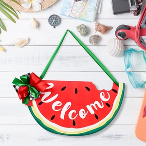 Watermelon Welcome sign with bow tie on summer travel background with hat and camera