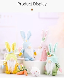 Detailed display of four colorful Easter gnome plush dolls with bunny ears on white steps