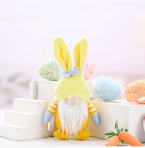 Detail of Easter gnome plush with bunny ears, white beard, and festive pastel decorations