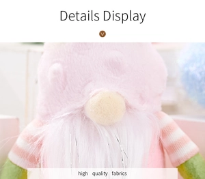 Detail of pink plush Easter gnome with textured hat and striped sleeves for party decor