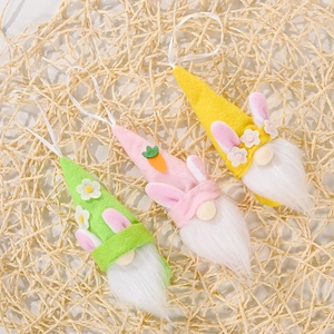 Easter gnome hanging ornaments with rabbit ears and carrots in pink green and yellow