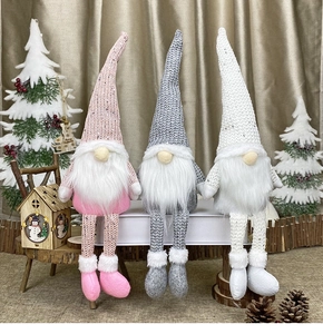 Three long-legged Christmas gnomes with sequined knit hats and white faux fur beards