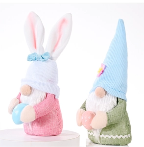 Detail of Easter gnomes with rabbit ears, knitted hats and colorful decorative eggs