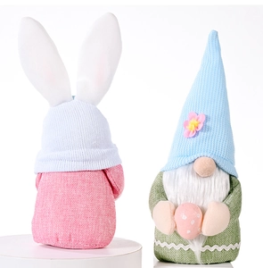 Easter gnome plush toys with pink bunny ears and holding a decorative pastel egg