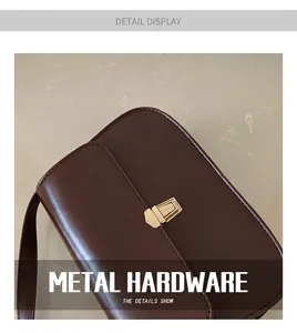 Detailed macro view of the dark brown leather texture and golden rectangular metal push lock