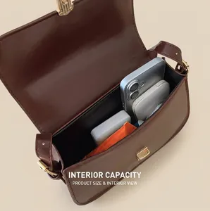 Internal capacity of the vintage brown shoulder bag showing daily items inside