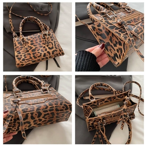 Detail view of leopard print crossbody bag showing textured PU leather and silver hardware