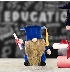 Detailed close-up of blue graduation gnome with scholar hat and diploma scroll