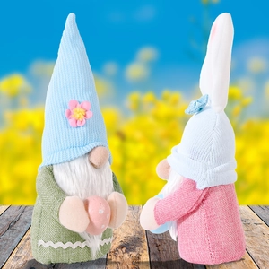 Easter gnome plush set with rabbit ears holding colorful eggs on wooden floor decor